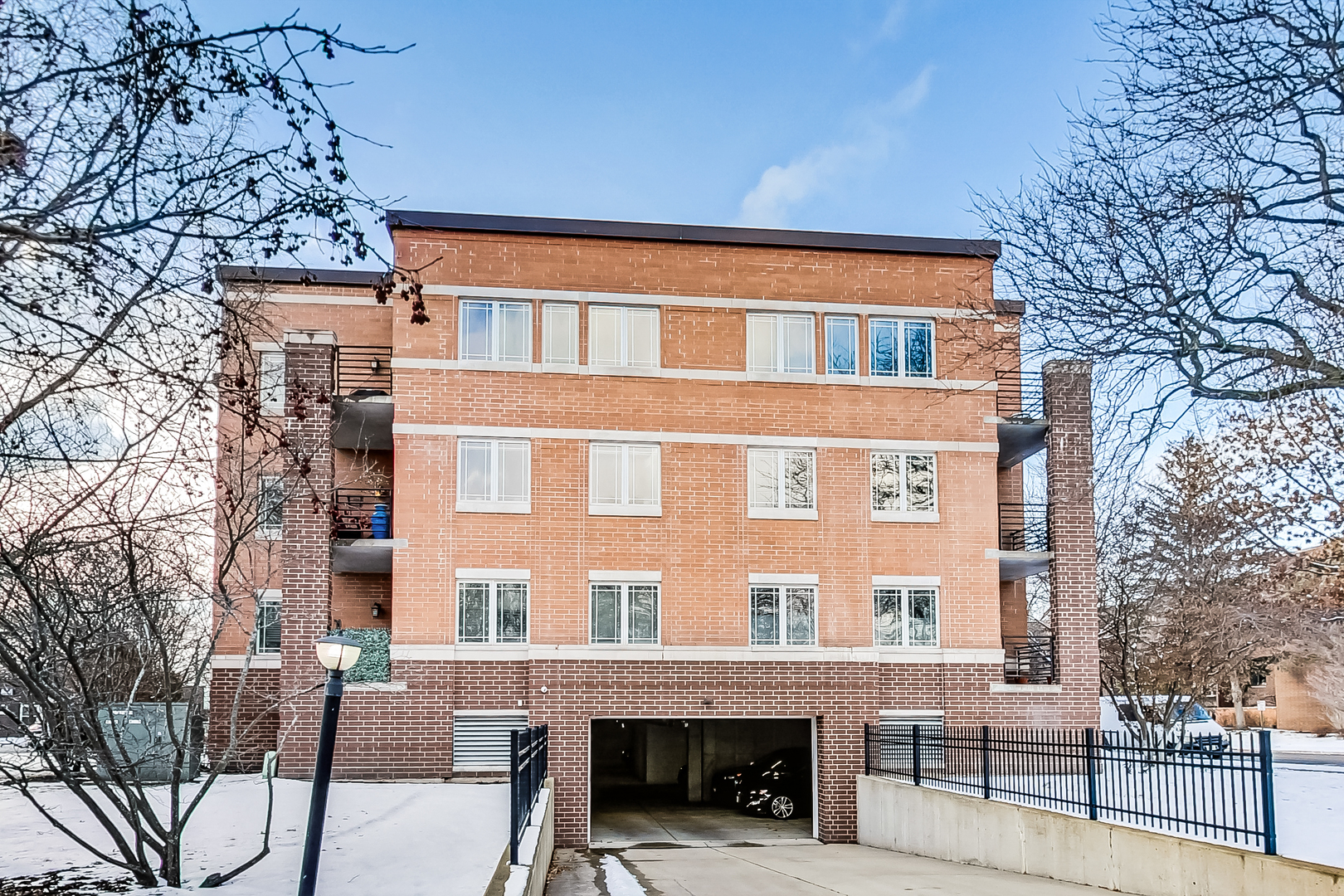 911 Busse Highway, Unit 204 Park Ridge, IL 60068 - Photo 28 of 31 a front view of a building with a garden