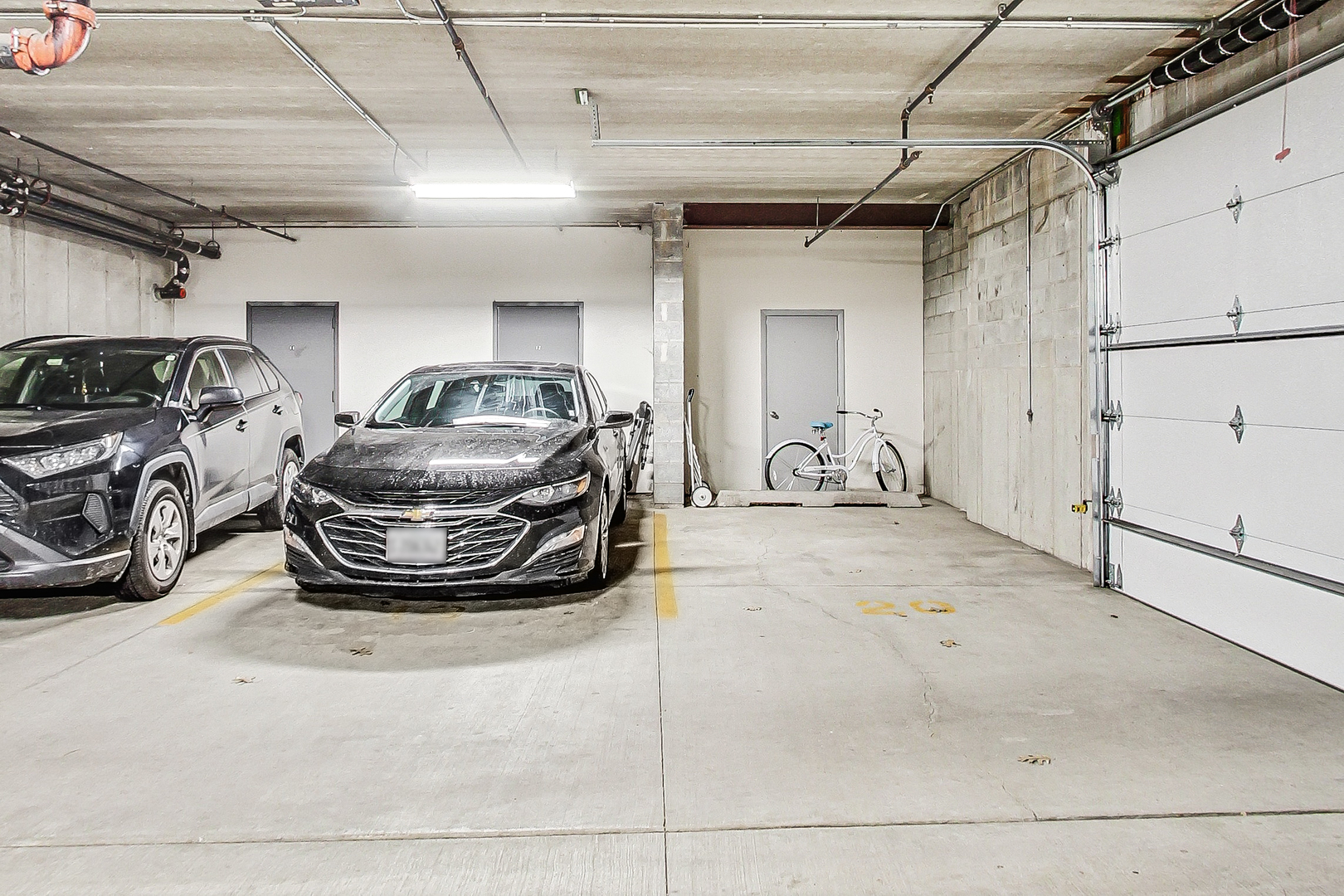 911 Busse Highway, Unit 204 Park Ridge, IL 60068 - Photo 29 of 31 a view of parking garage with cars