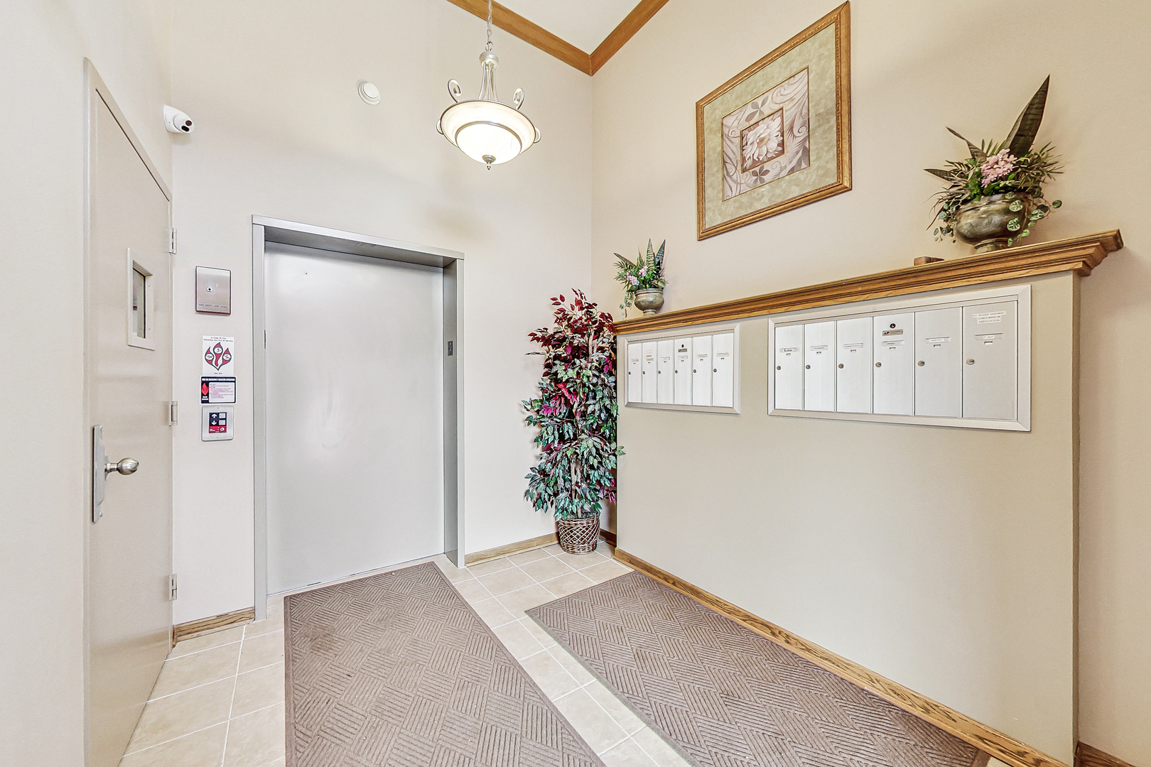 911 Busse Highway, Unit 204 Park Ridge, IL 60068 - Photo 3 of 31 a view of entryway with elevator