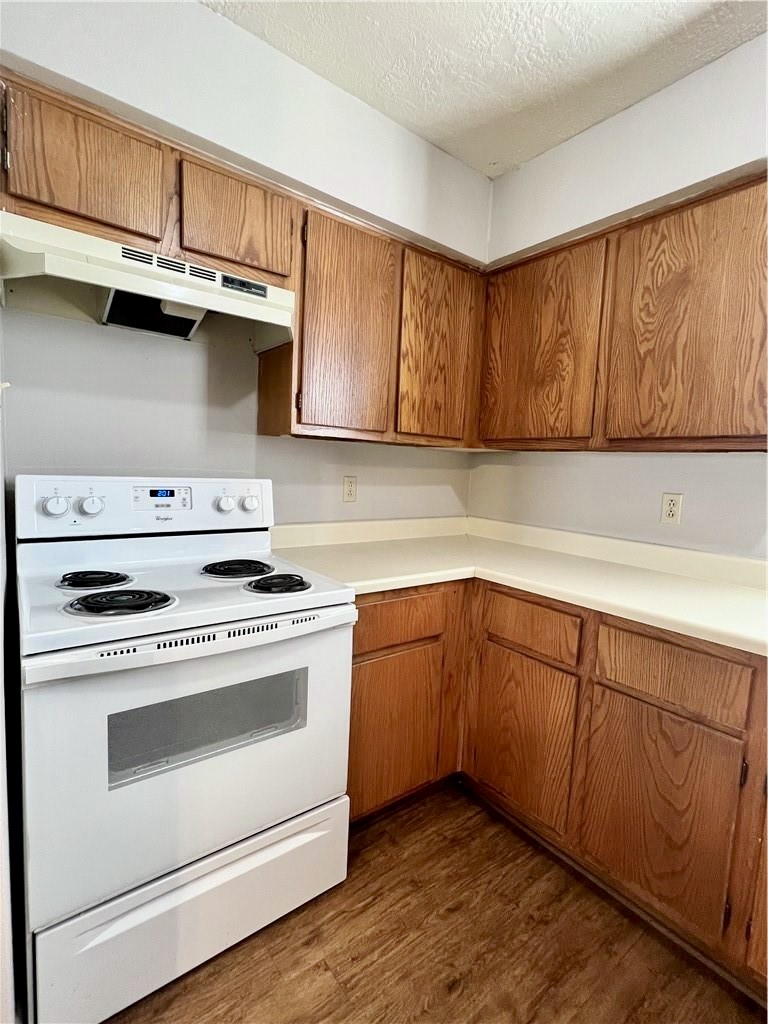 918 Spring Loop, Unit A College Station, TX 77840 - Photo 7 of 12 a kitchen with stainless steel appliances granite countertop a sink a stove and cabinets