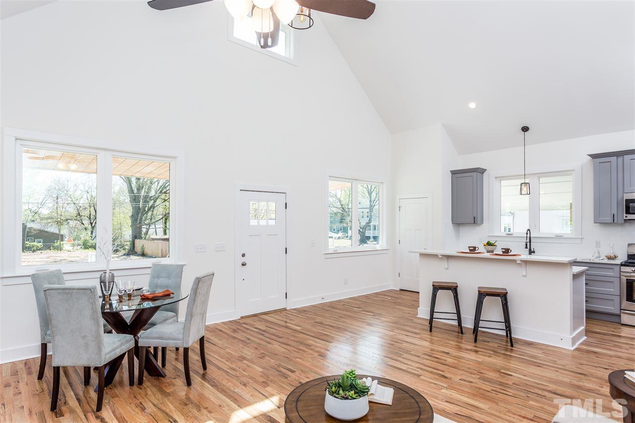 811 Postell Street Raleigh, NC 27601 - Photo 2 of 20 a view of a dining room with furniture and wooden floor
