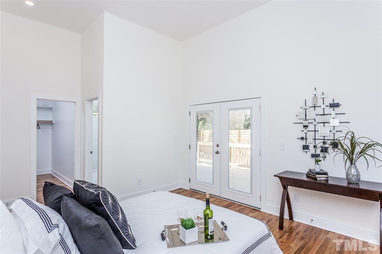 811 Postell Street Raleigh, NC 27601 - Photo 11 of 20 a bedroom with a bed and a table