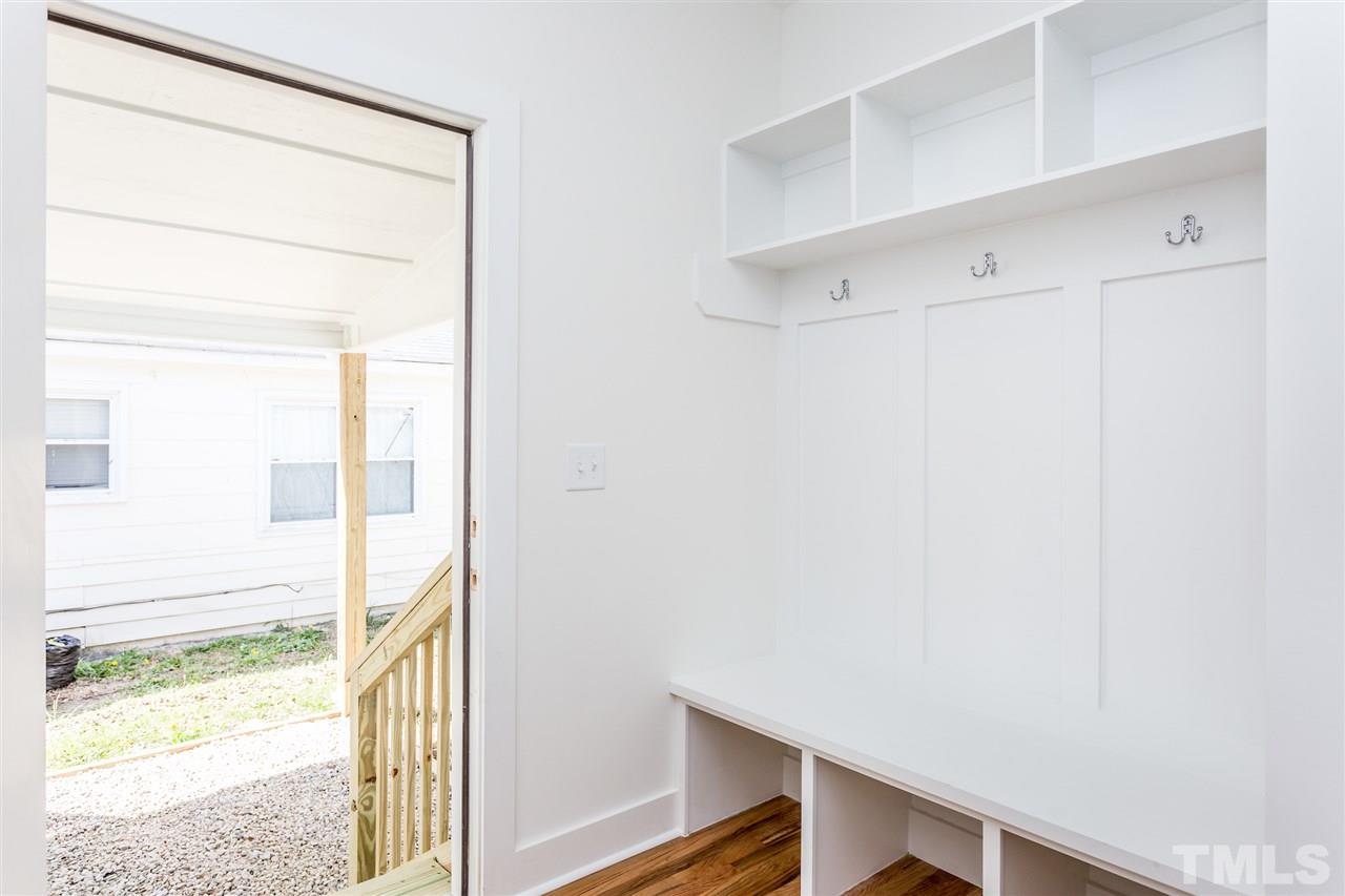 811 Postell Street Raleigh, NC 27601 - Photo 17 of 20 a view of a room with wooden floor and windows