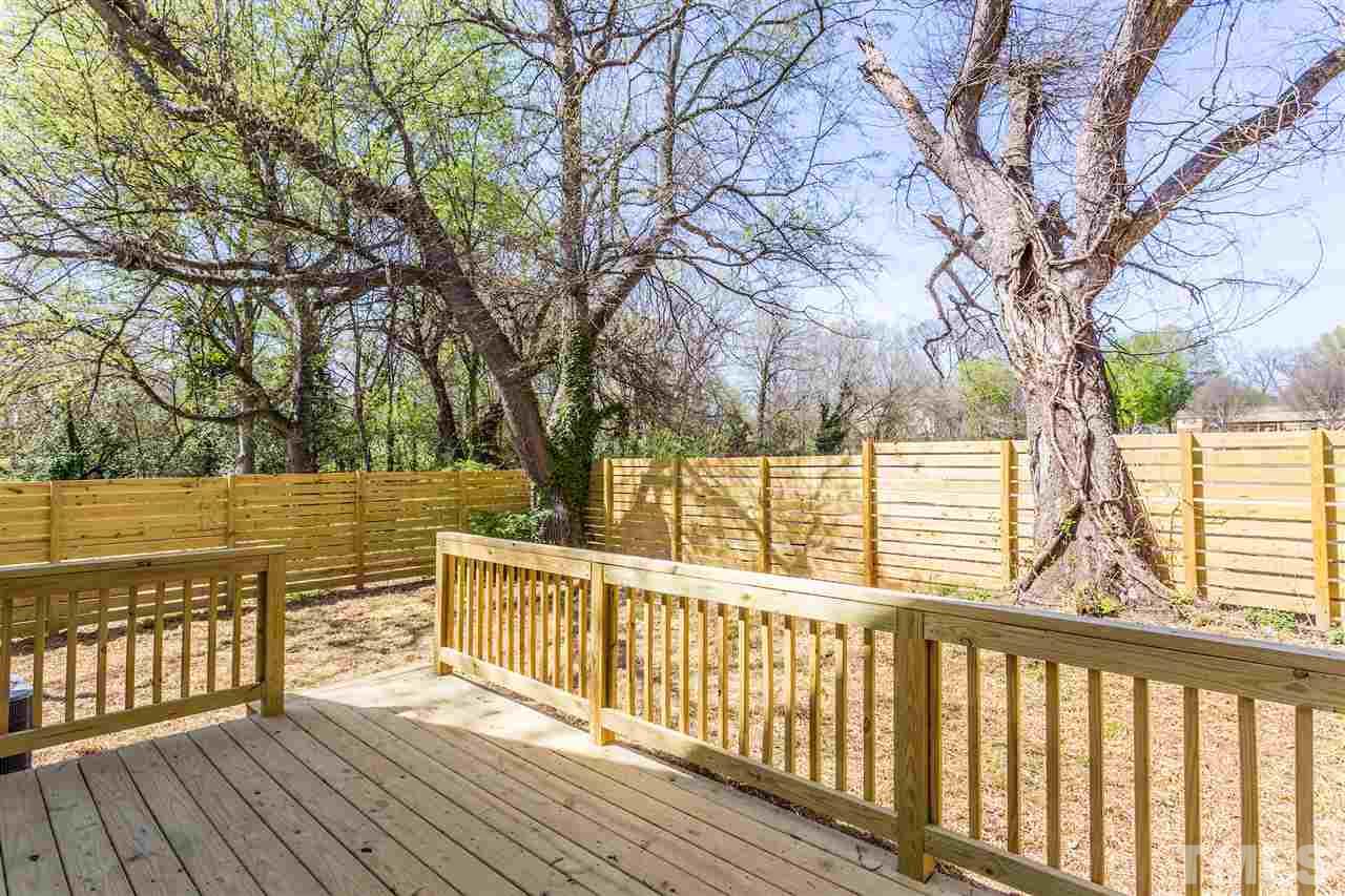 811 Postell Street Raleigh, NC 27601 - Photo 18 of 20 a view of balcony with wooden floor and fence