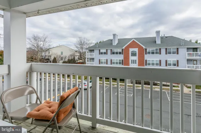 a view of a chair and table in the balcony
