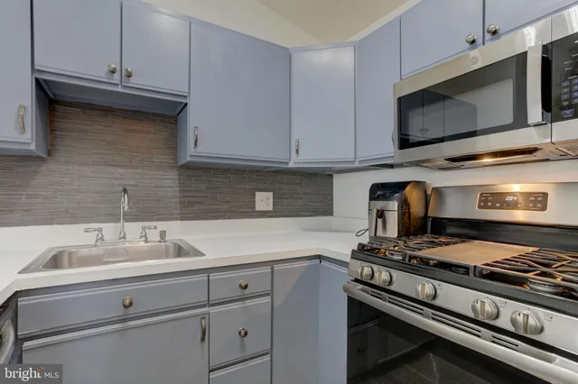 a kitchen with a stove and a microwave