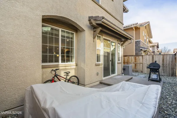 a front view of a house with outdoor seating