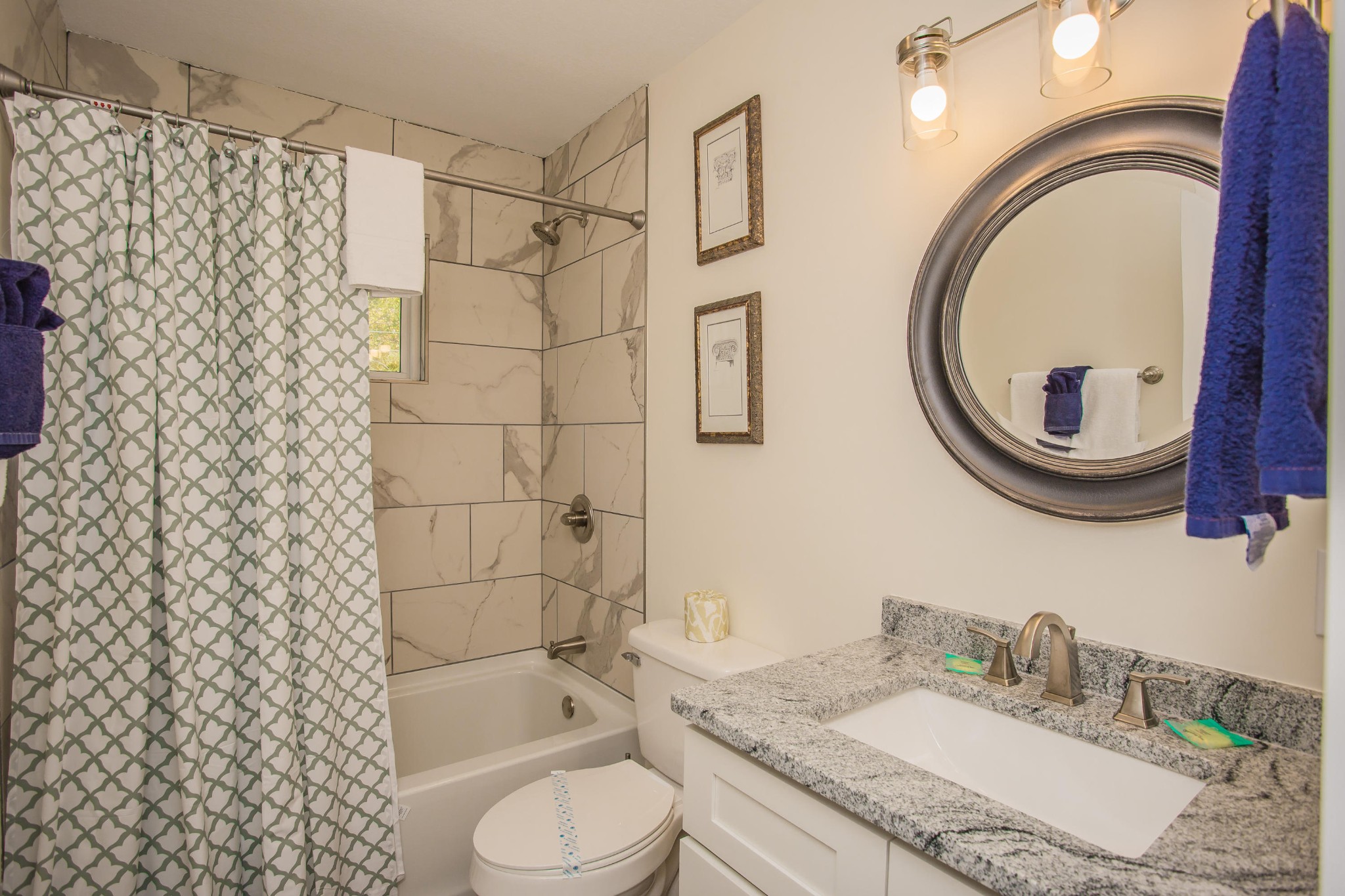 3202 Hickey Road Sevierville, TN 37876 - Photo 13 of 28 a bathroom with a granite countertop sink toilet a mirror and shower