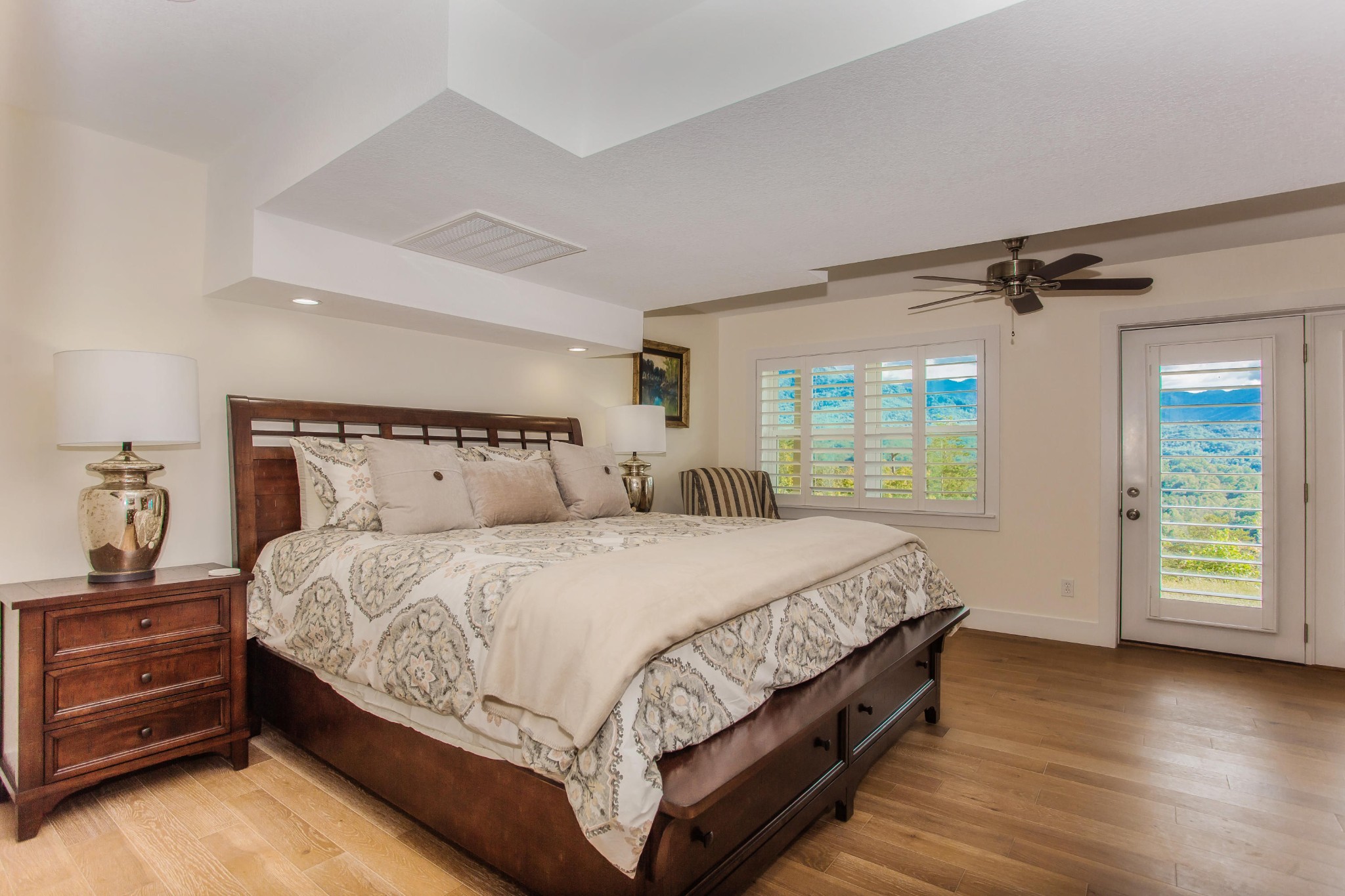 3202 Hickey Road Sevierville, TN 37876 - Photo 14 of 28 a bed sitting in a bedroom next to a window
