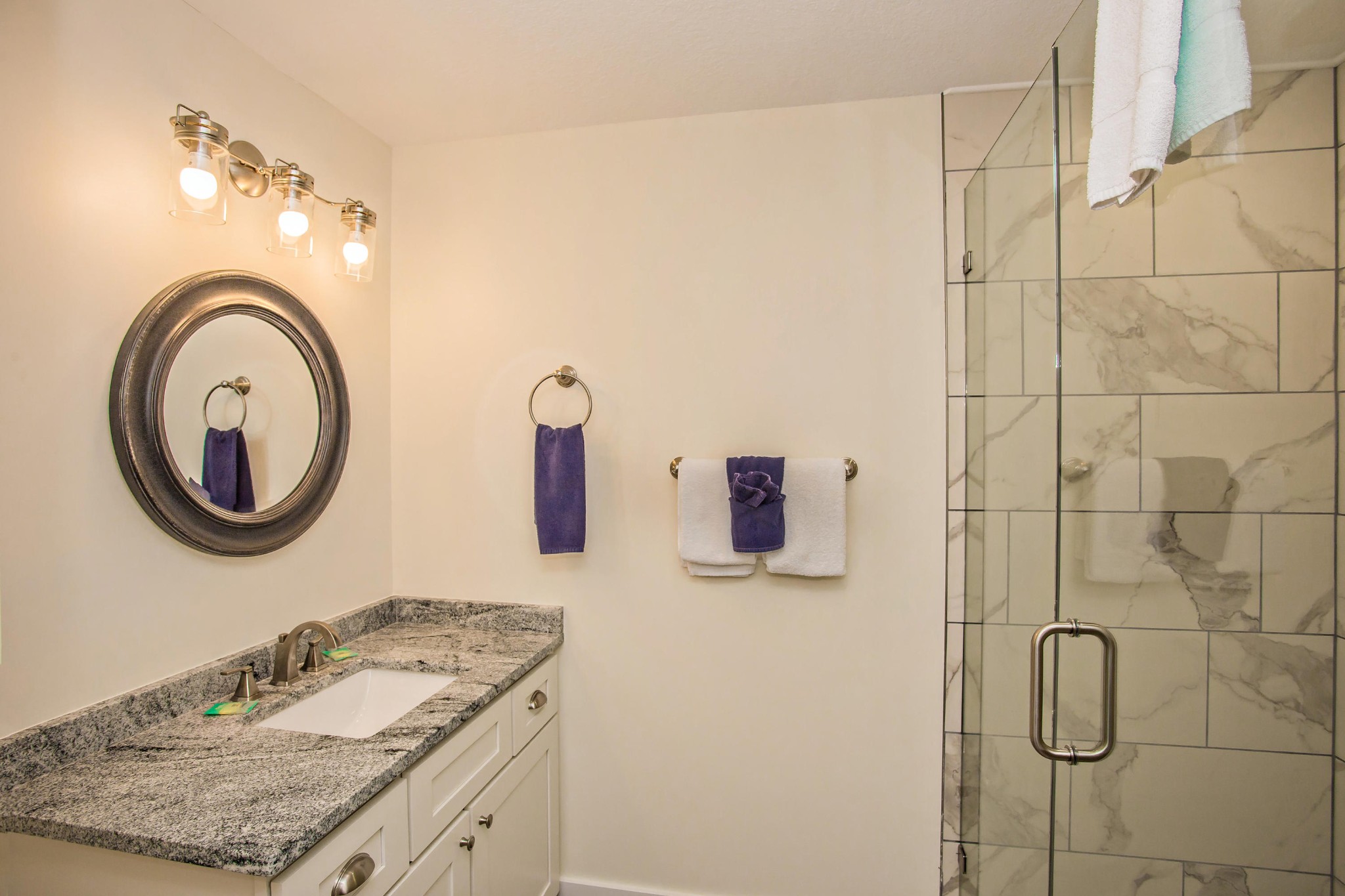 3202 Hickey Road Sevierville, TN 37876 - Photo 19 of 28 a bathroom with a granite countertop sink and a mirror