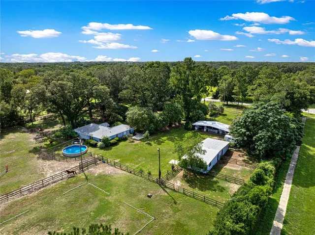 a view of a swimming pool with a yard