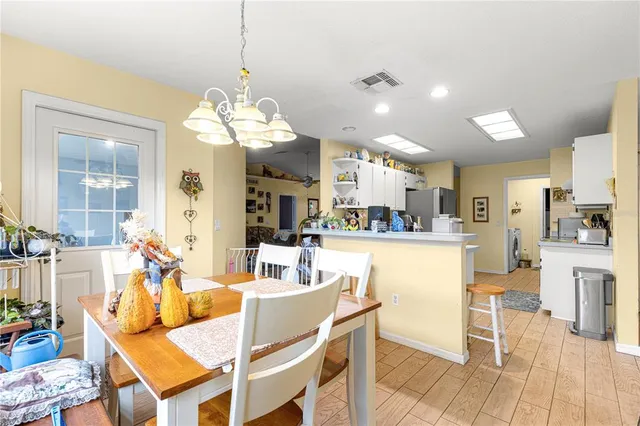 a kitchen with refrigerator and cabinets
