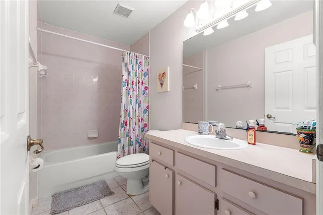 a bedroom with bed and a window