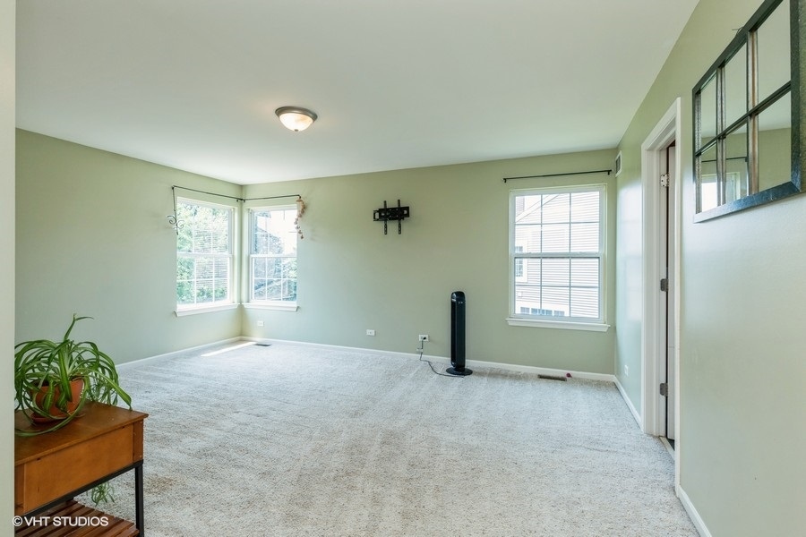 9675 Newton Road Huntley, IL 60142 - Photo 13 of 18 a view of an empty room with a window