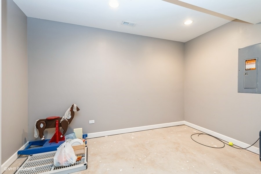 9675 Newton Road Huntley, IL 60142 - Photo 16 of 18 a room with furniture and air conditioner vent