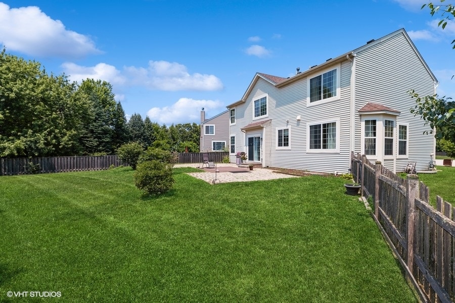 9675 Newton Road Huntley, IL 60142 - Photo 18 of 18 a front view of house with yard and green space