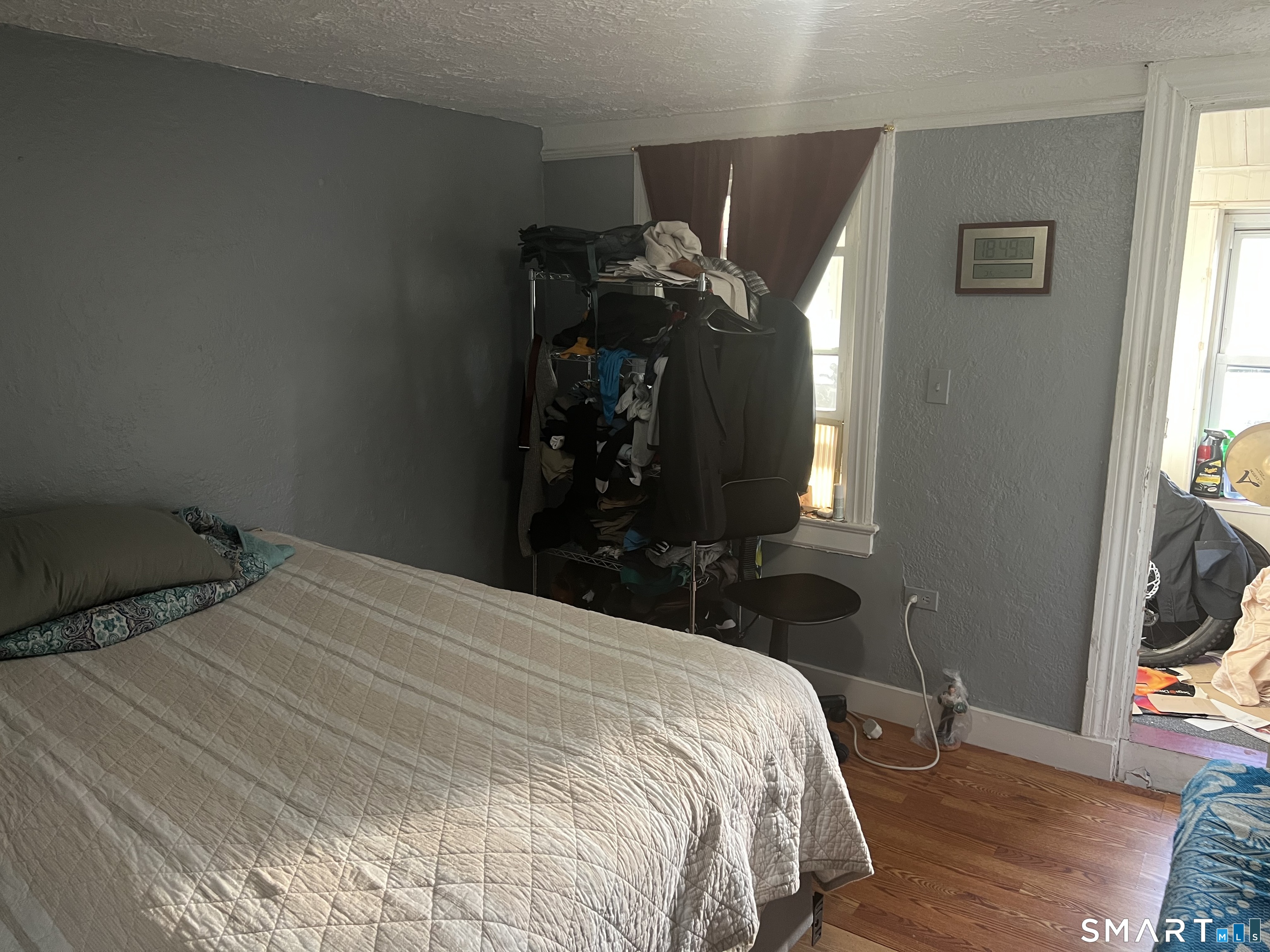 275 Long Ridge Road Stamford, CT 06905 - Photo 35 of 40 a bed sitting in a bedroom next to a window