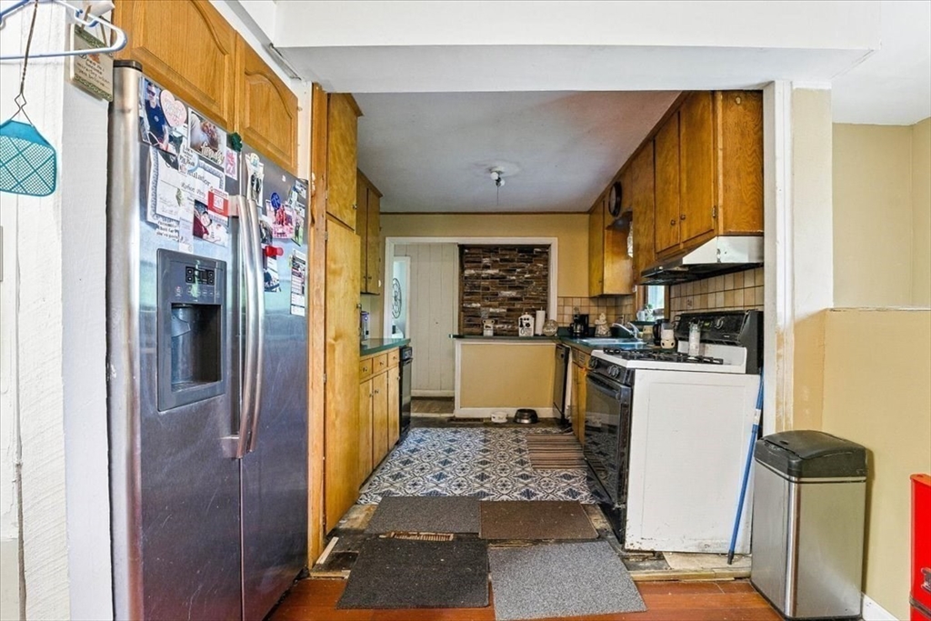 15 Kalmia Road Holbrook, MA 02343 - Photo 11 of 21 a kitchen with stainless steel appliances granite countertop a refrigerator and a stove