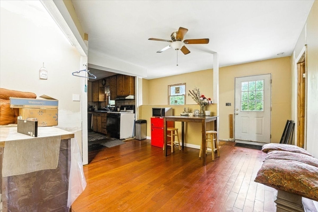 15 Kalmia Road Holbrook, MA 02343 - Photo 12 of 21 a view of a livingroom with furniture a ceiling fan and wooden floor