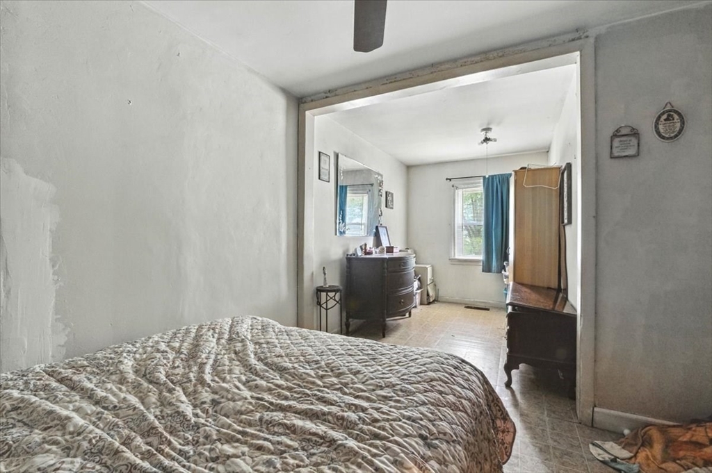 15 Kalmia Road Holbrook, MA 02343 - Photo 15 of 21 a bedroom with a bed and wooden floor
