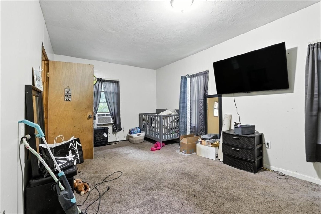 15 Kalmia Road Holbrook, MA 02343 - Photo 17 of 21 a living room with furniture and a flat screen tv