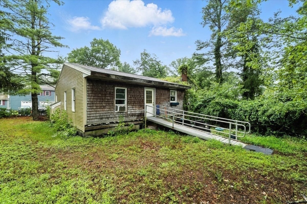 15 Kalmia Road Holbrook, MA 02343 - Photo 3 of 21 a backyard of a house with lots of green space
