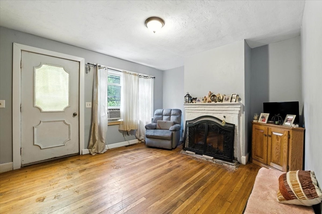 15 Kalmia Road Holbrook, MA 02343 - Photo 7 of 21 a living room with furniture and a fireplace