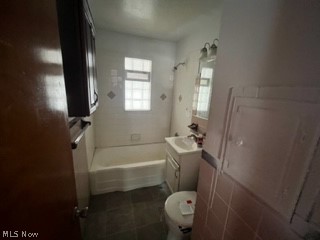 13210 Rockside Road Garfield Heights, OH 44125 - Photo 9 of 15 Full bathroom with tub / shower combination, toilet, tile flooring, and vanity
