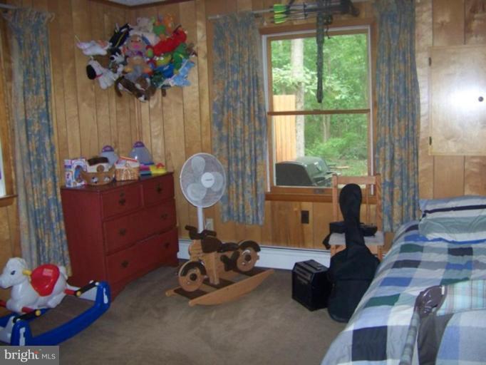 6981 Breeding Road Federalsburg, MD 21632 - Photo 6 of 7 a room with gym equipment and a large window