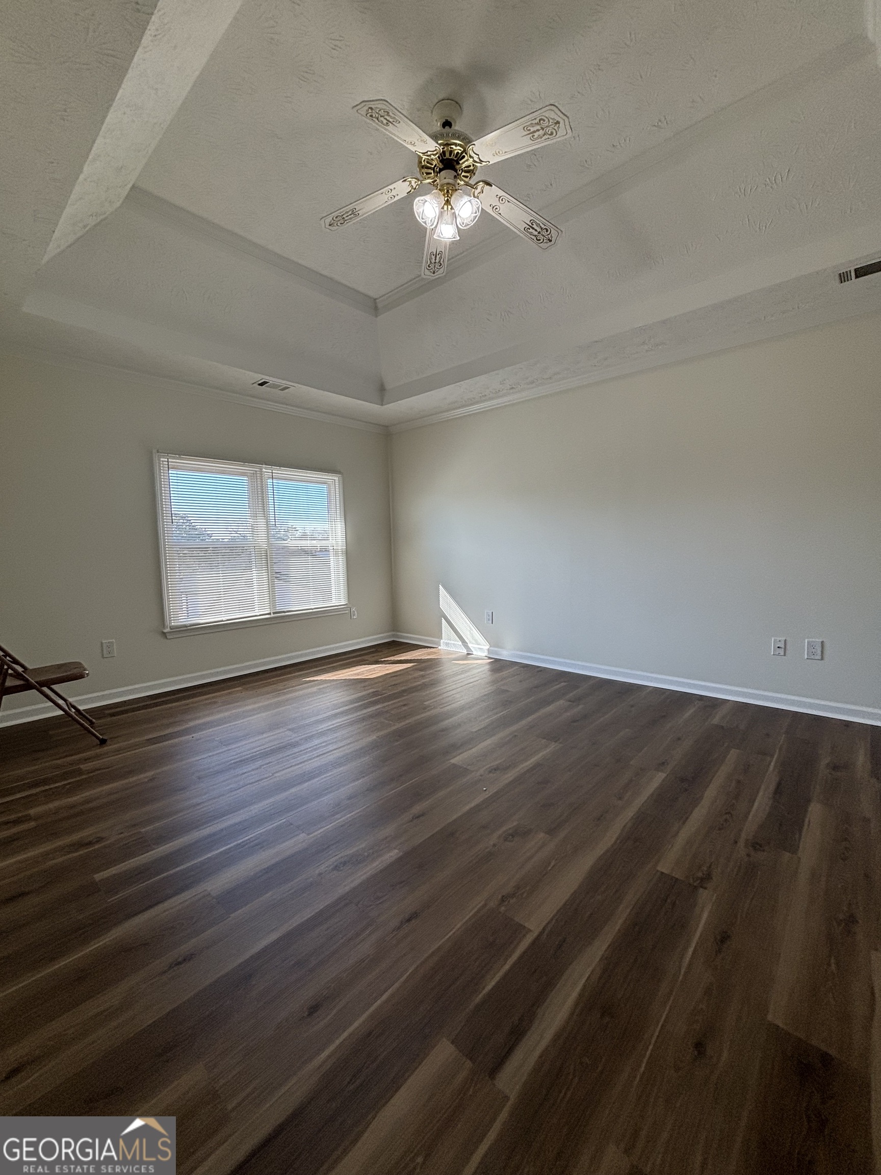 2972 Hampton Place Decatur, GA 30034 - Photo 11 of 19 an empty room with wooden floor chandelier fan and windows