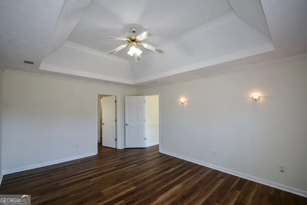a bath tub sitting in a bathroom next to a window