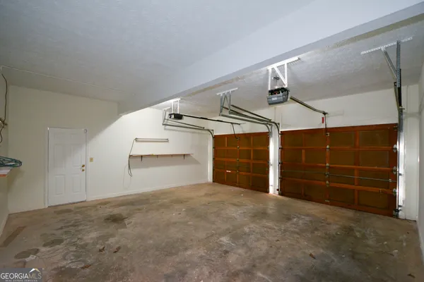 a dining room with furniture a rug and wooden floor