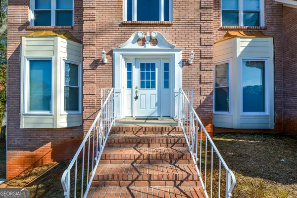 front view of a house with a large window