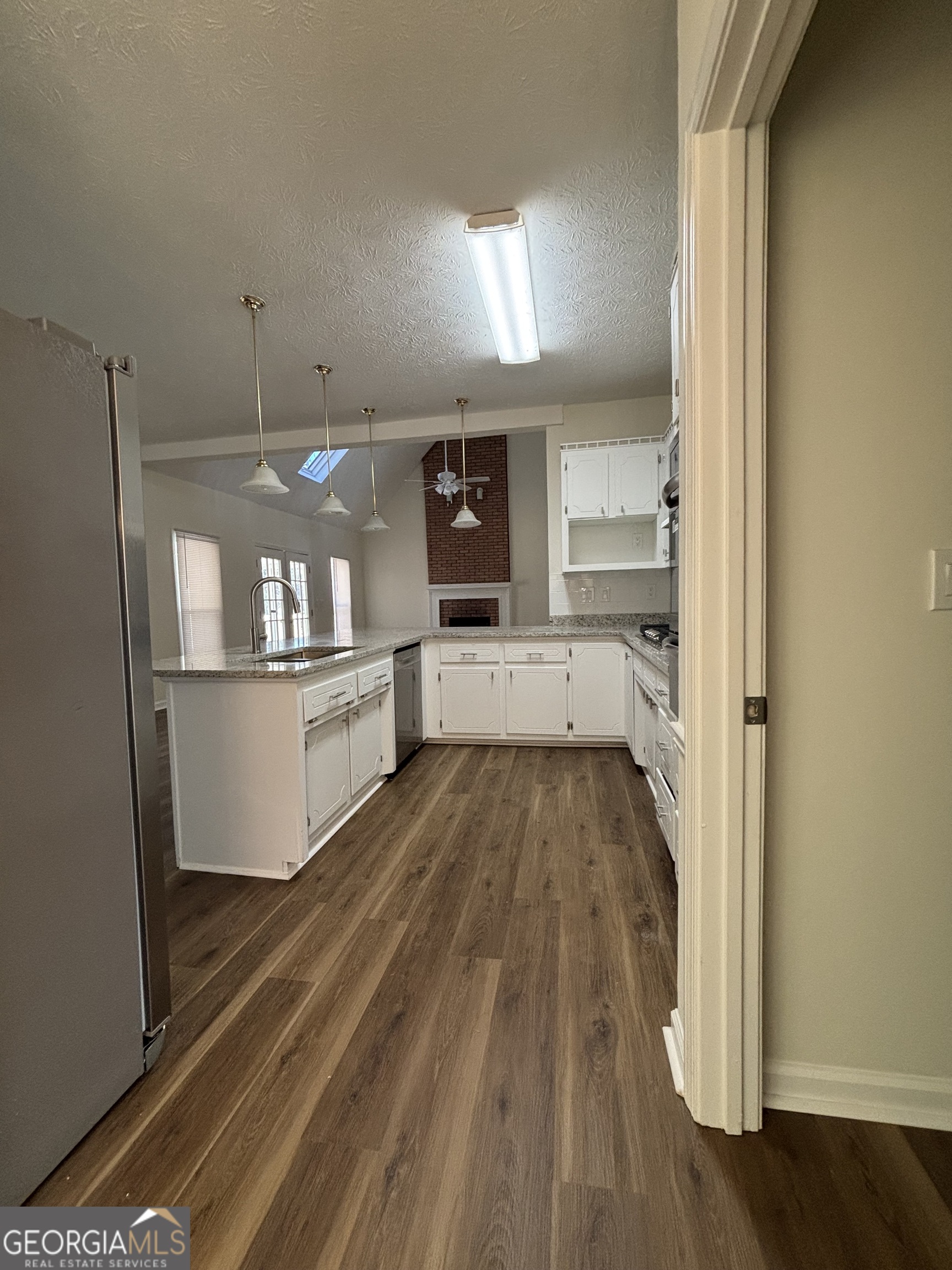 2972 Hampton Place Decatur, GA 30034 - Photo 7 of 19 a view of a kitchen with wooden floor and electronic appliances