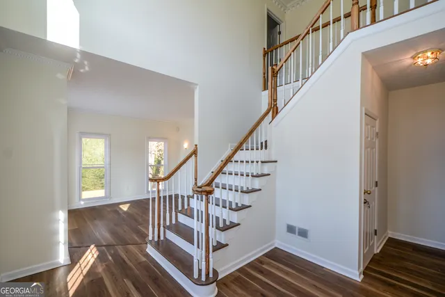 a view of a room with window and wooden floor