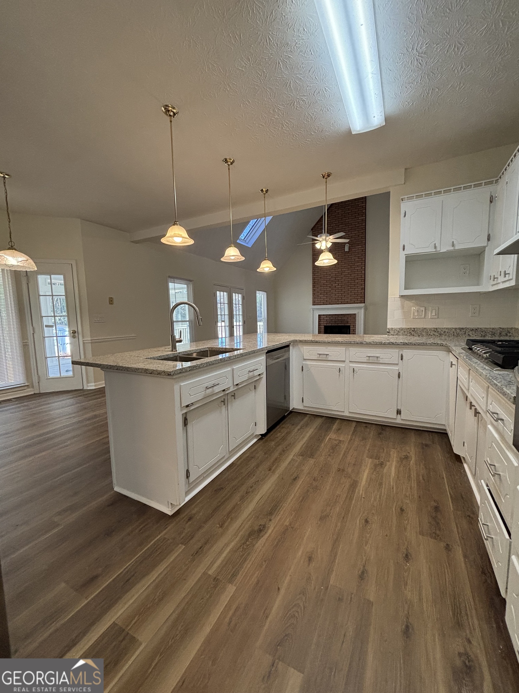 2972 Hampton Place Decatur, GA 30034 - Photo 10 of 19 a large kitchen with stainless steel appliances granite countertop a stove and a wooden floors