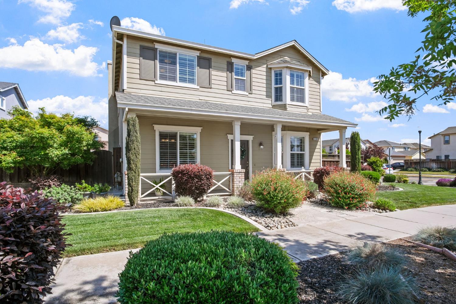 4160 North Berkeley Avenue Turlock, CA 95382 - Photo 1 of 1 a front view of a house with garden and porch