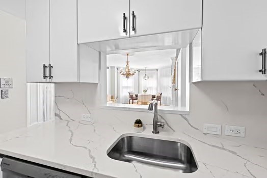 302 Commonwealth Avenue, Unit E Boston, MA 02115 - Photo 5 of 13 a bathroom with a sink and a mirror