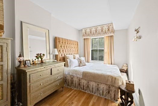 302 Commonwealth Avenue, Unit E Boston, MA 02115 - Photo 7 of 13 a bedroom with a bed and a large window