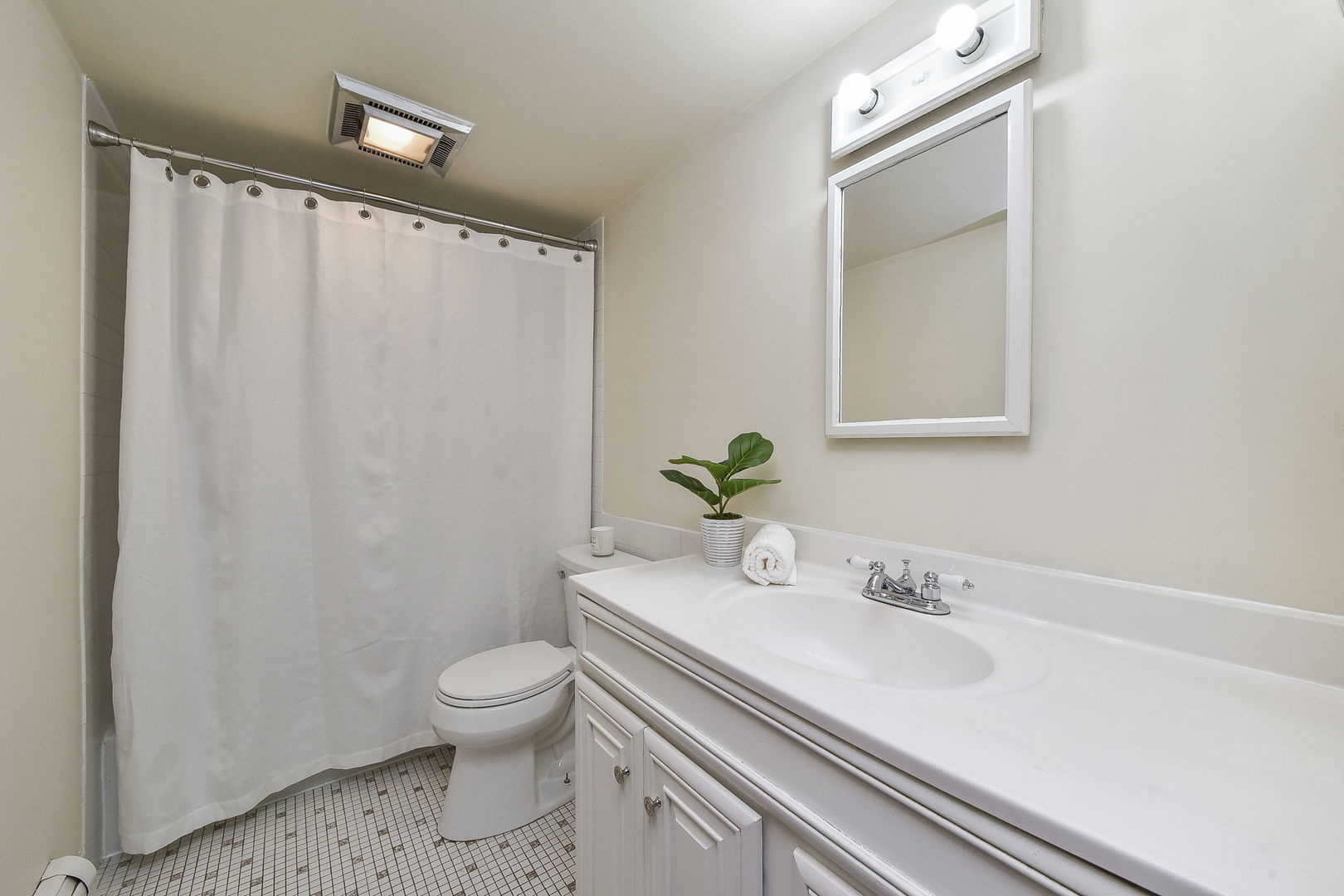 238 East Bailey Road, Unit G Naperville, IL 60565 - Photo 12 of 22 a bathroom with a sink a toilet and a mirror