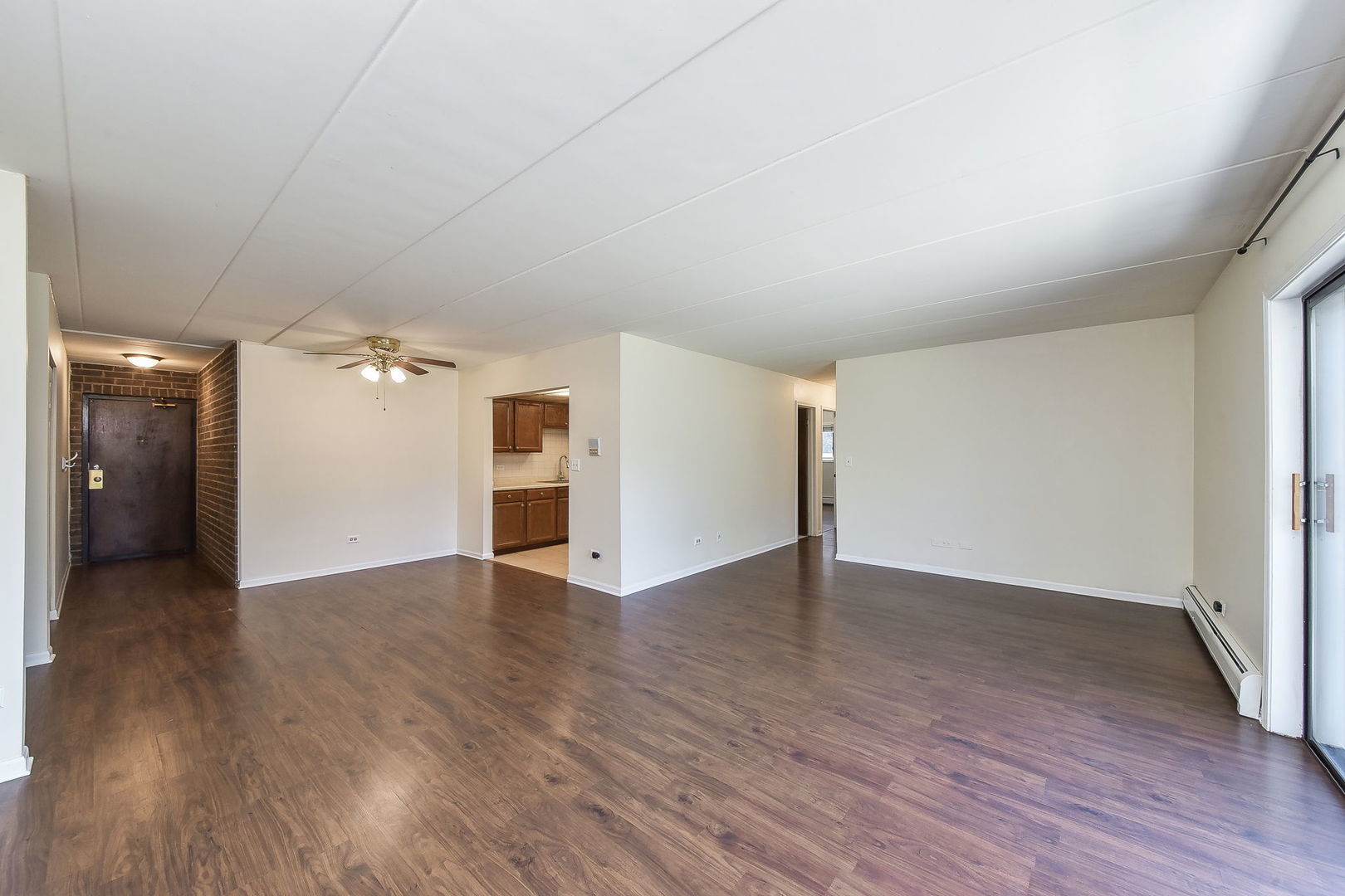 238 East Bailey Road, Unit G Naperville, IL 60565 - Photo 6 of 22 an empty room with wooden floor and windows