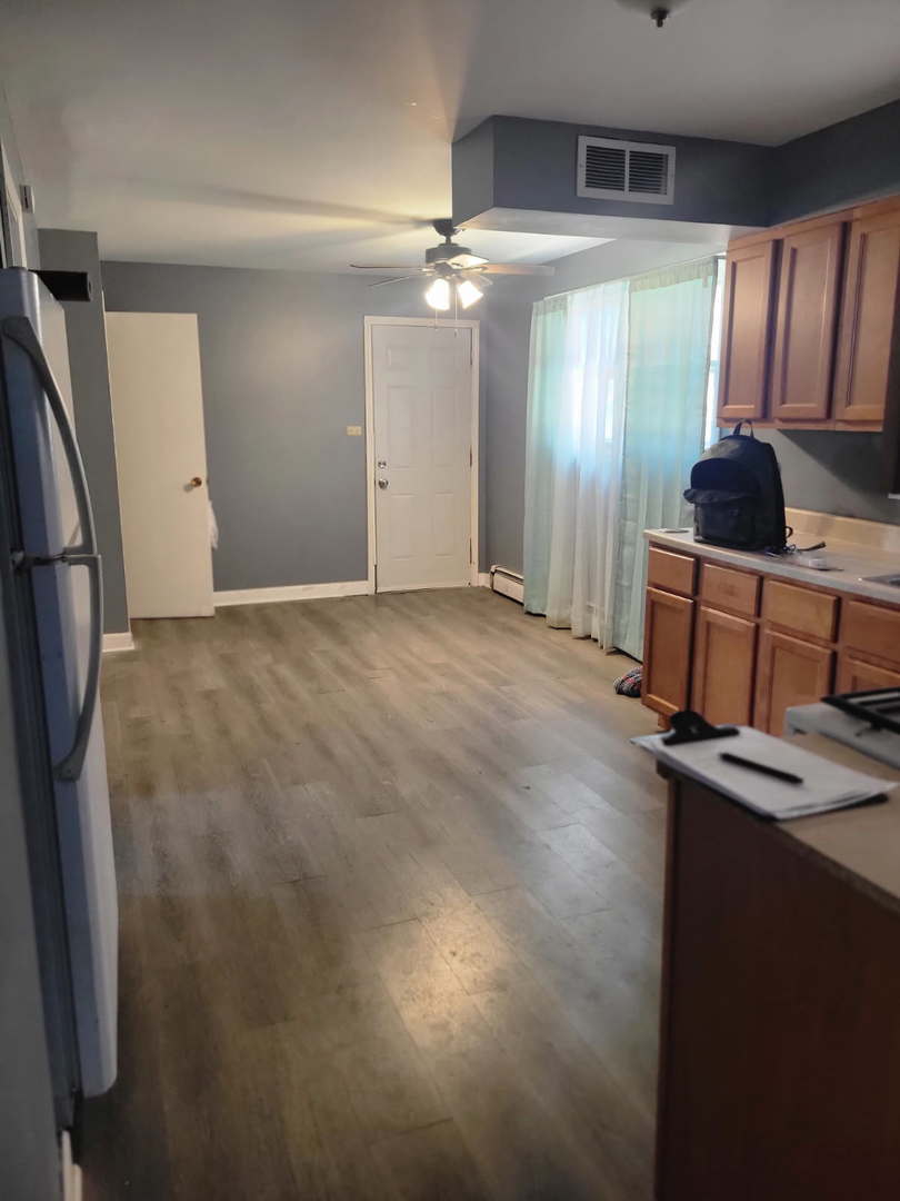 14652 Spaulding Avenue Harvey, IL 60426 - Photo 10 of 18 a view of kitchen with refrigerator and window