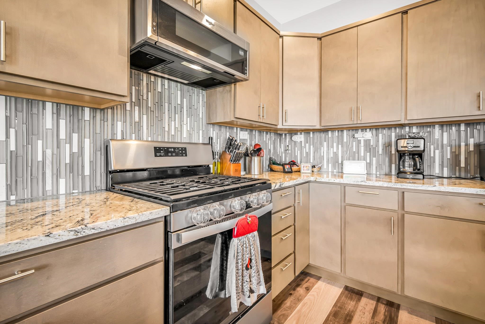 506 Grama Court Grand Junction, CO 81504 - Photo 11 of 28 a kitchen with a stove and a white refrigerator