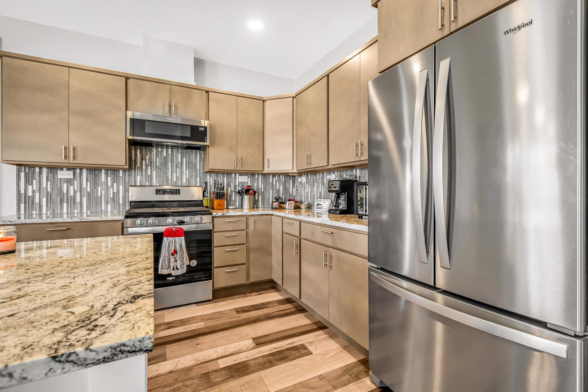 506 Grama Court Grand Junction, CO 81504 - Photo 12 of 28 a kitchen with stainless steel appliances a refrigerator sink and cabinets