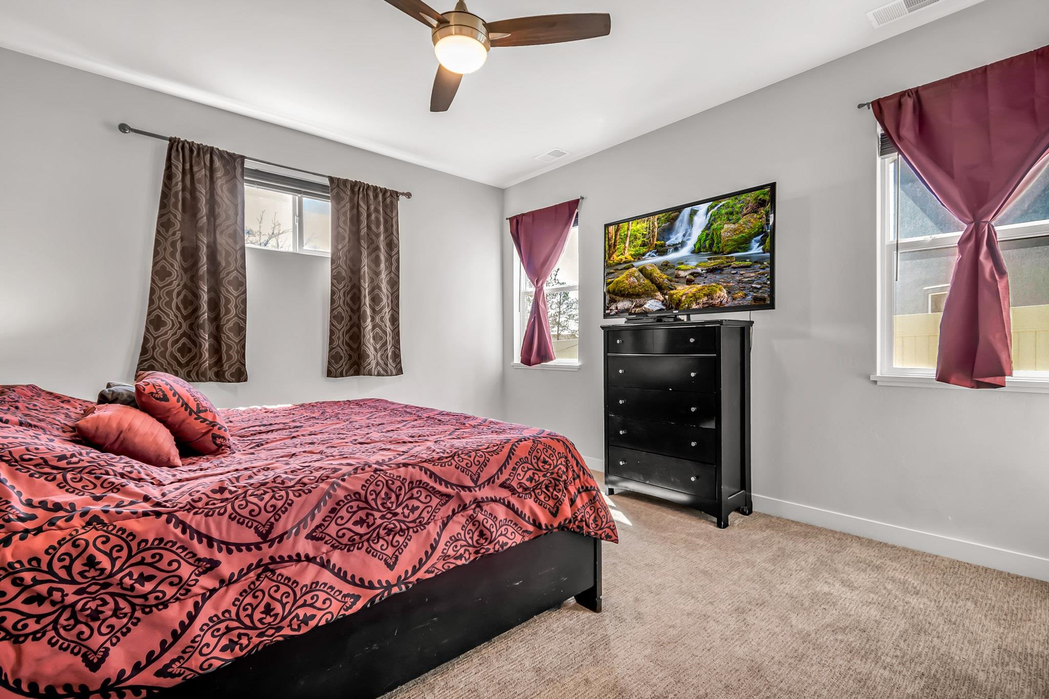 506 Grama Court Grand Junction, CO 81504 - Photo 14 of 28 a bedroom with a bed and a window