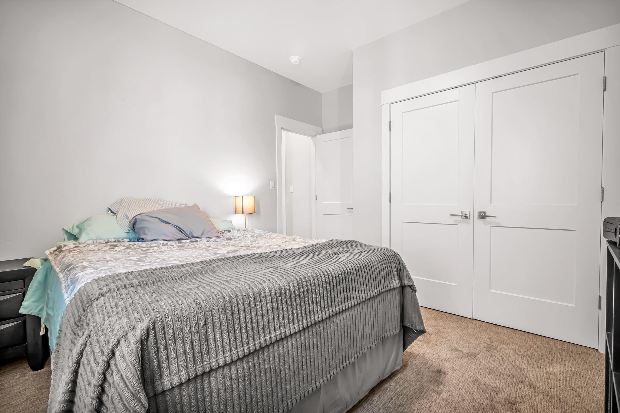 506 Grama Court Grand Junction, CO 81504 - Photo 19 of 28 a bedroom with a bed and a window