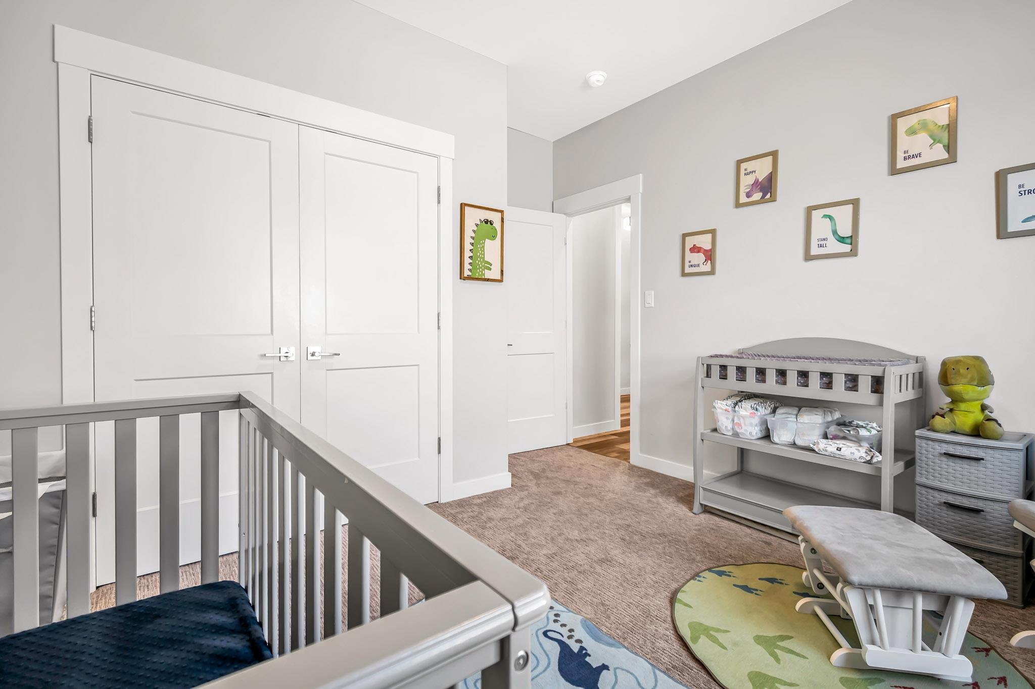 506 Grama Court Grand Junction, CO 81504 - Photo 24 of 28 a bedroom with a bed and wooden floor