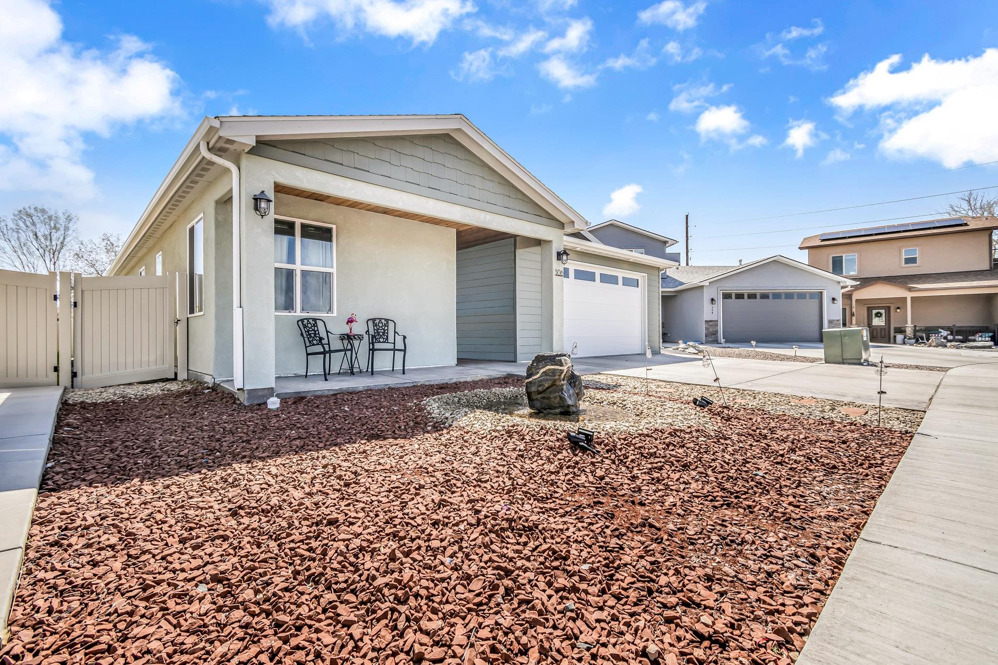 506 Grama Court Grand Junction, CO 81504 - Photo 4 of 28 a front view of a house with a yard
