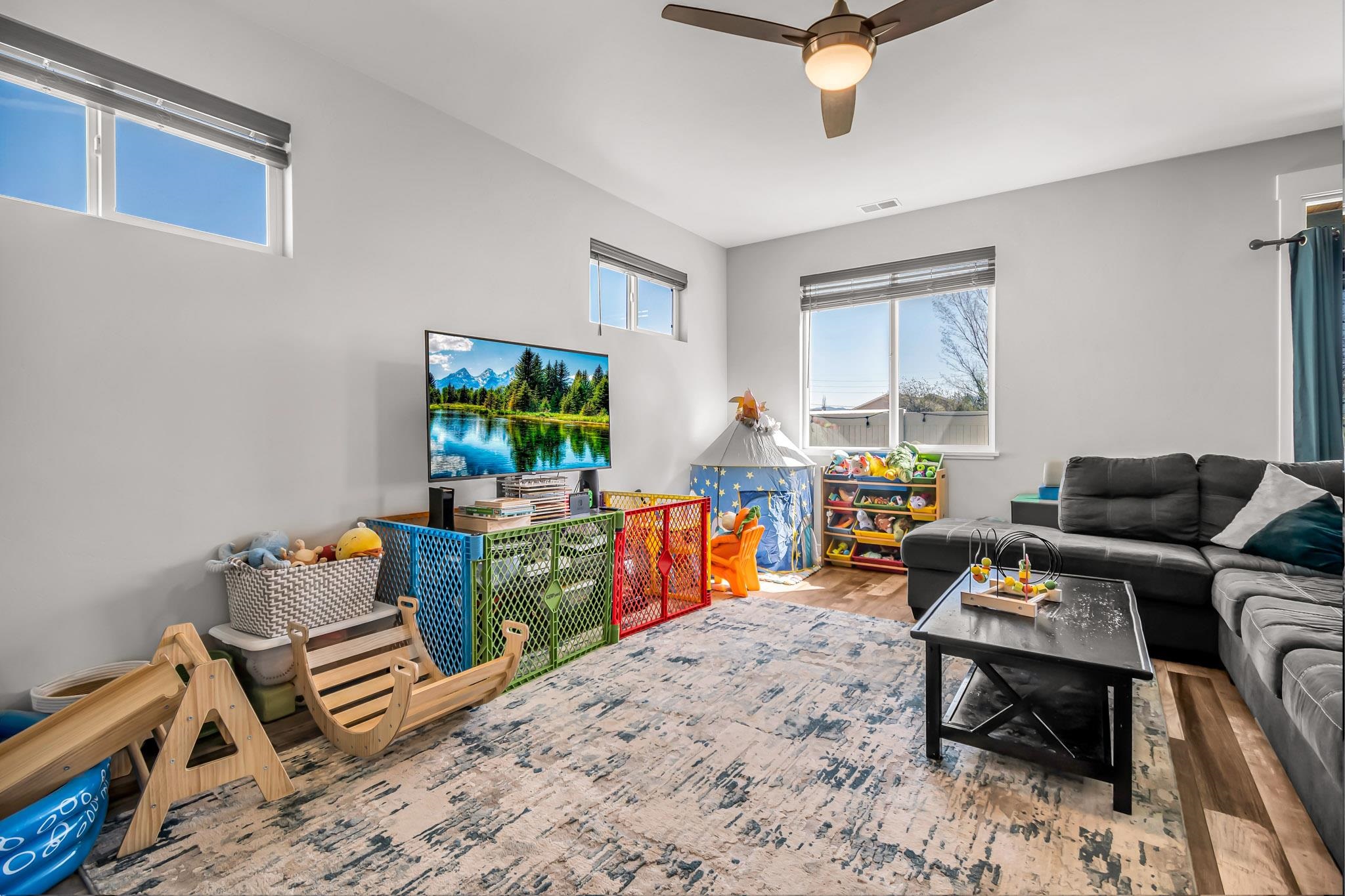 506 Grama Court Grand Junction, CO 81504 - Photo 7 of 28 a living room with furniture and a flat screen tv