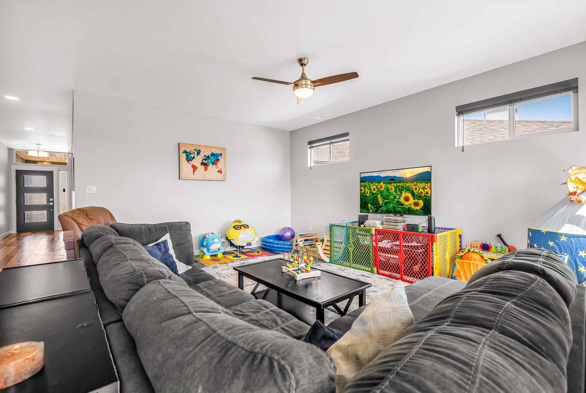 506 Grama Court Grand Junction, CO 81504 - Photo 8 of 28 a living room with furniture and a wooden floor